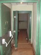 Looking Into Hallway To Firing Room. Blast door looks like the same type door used for a walk-in freezer.
